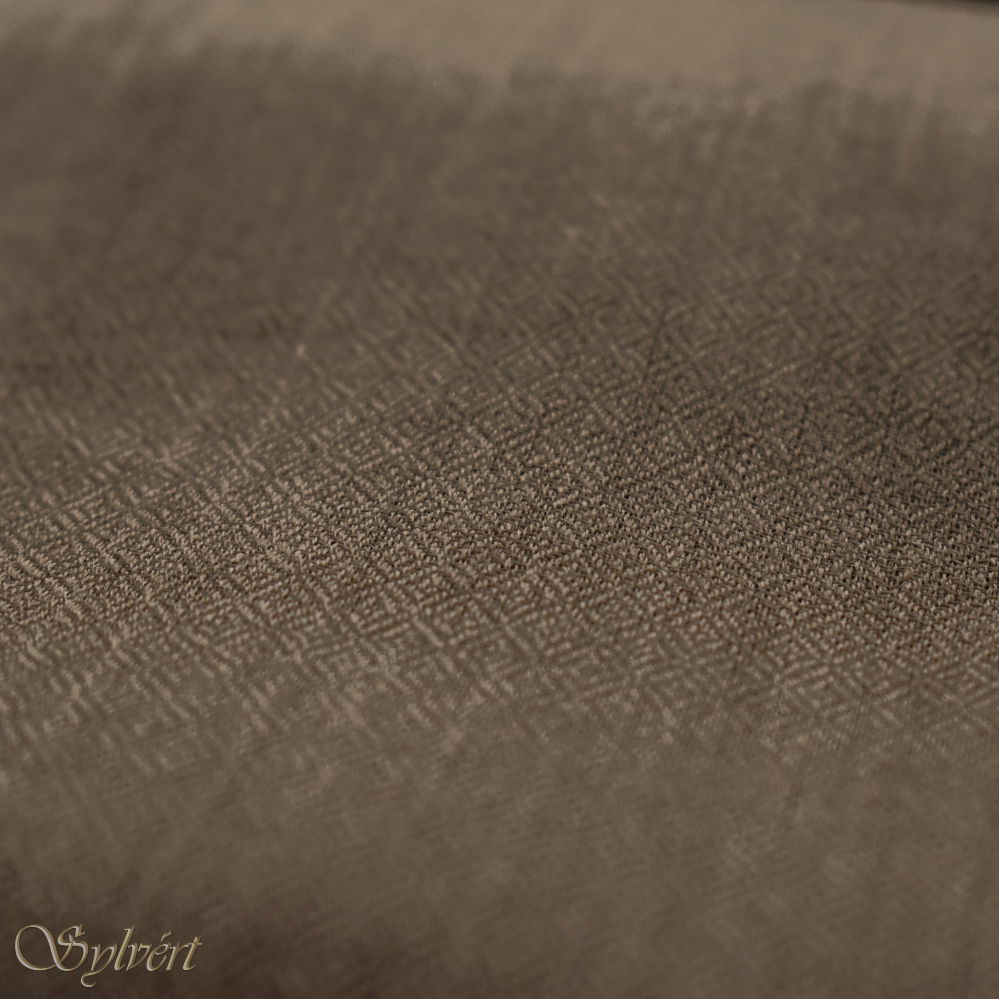 A natural "blush" cashmere Rivella Relor Scarf from Sylvért's Rivanor Collection, showing the diamond weave texture