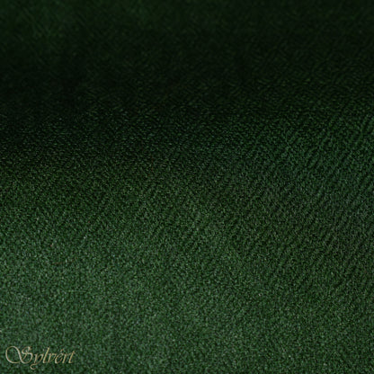 A green cashmere Rivella Tavon Scarf from Sylvért's Rivanor Collection, folded to show the diamond weave texture.
