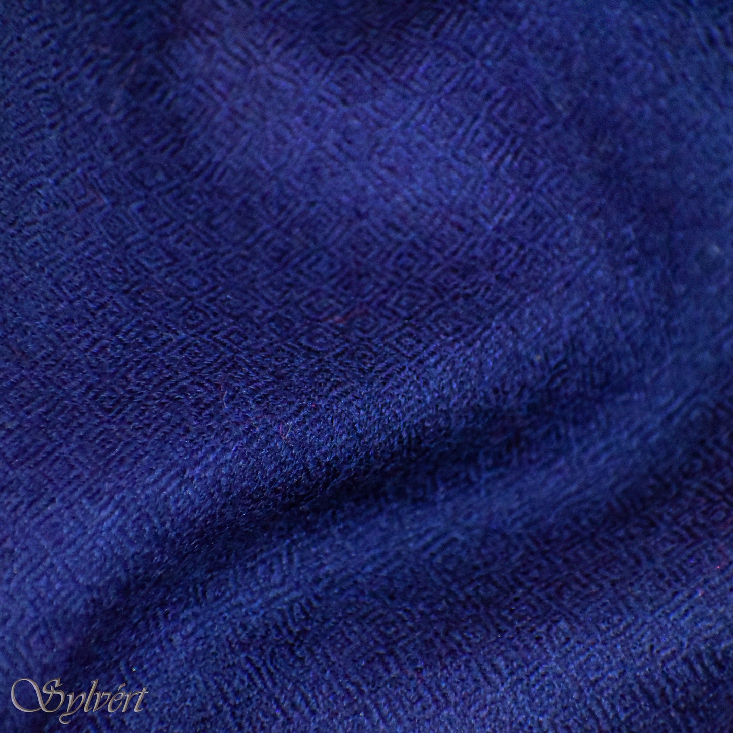 A blue Corvella Norien from Sylvért's Coronis collection, folded to show the diamond weave texture 