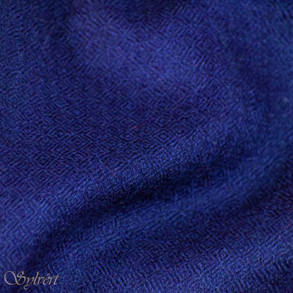 A blue Corvella Norien from Sylvért's Coronis collection, folded to show the diamond weave texture 